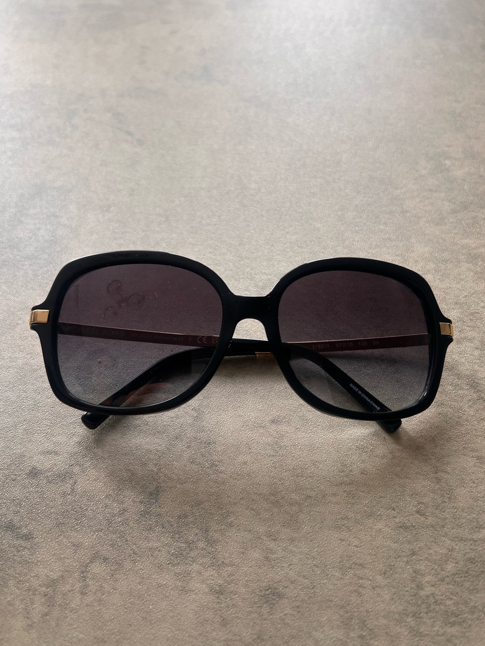Michael Kors Black and Gold Sunglasses with Sleek Design